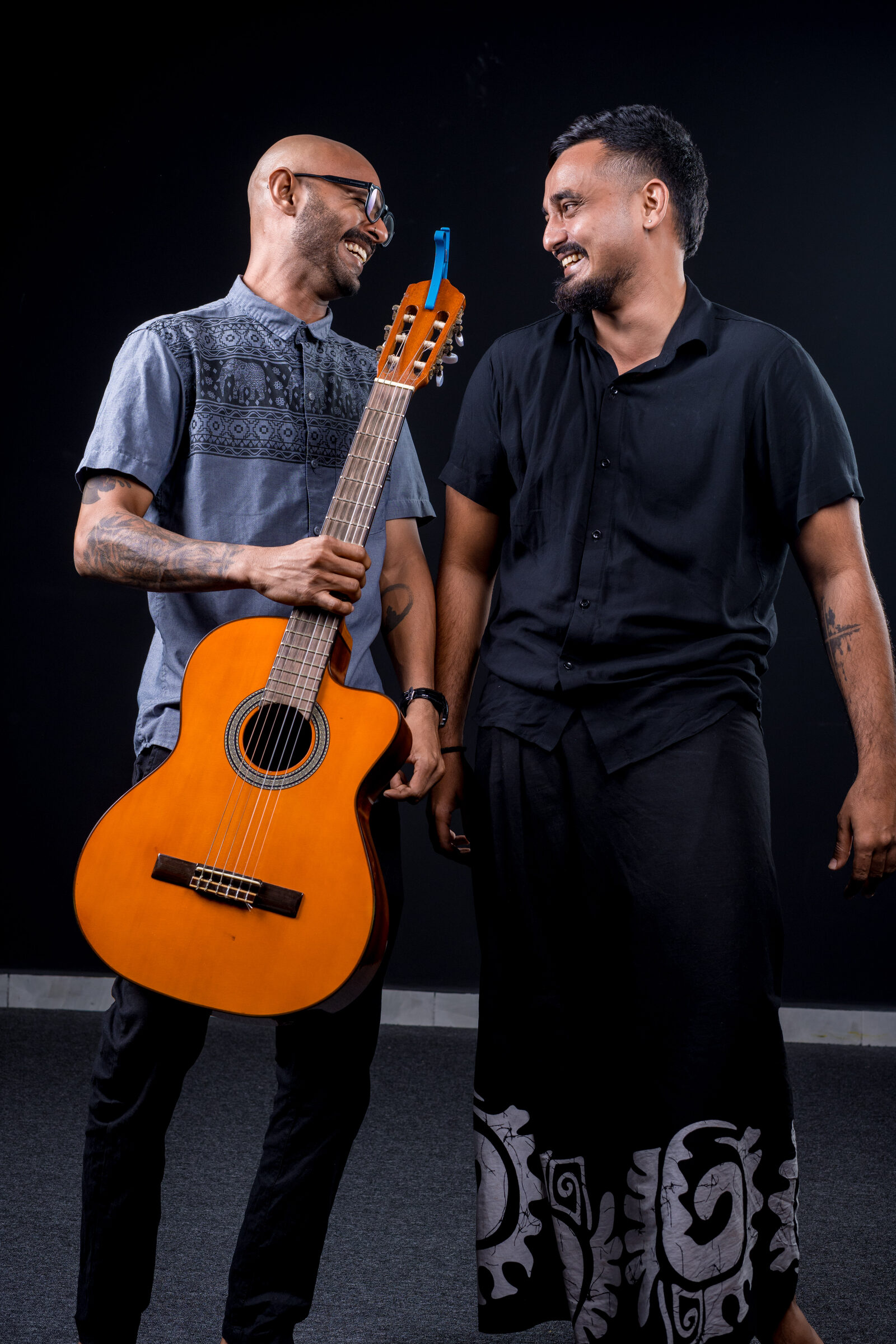 The Authentic duo, guitarist and singer, laughing together
