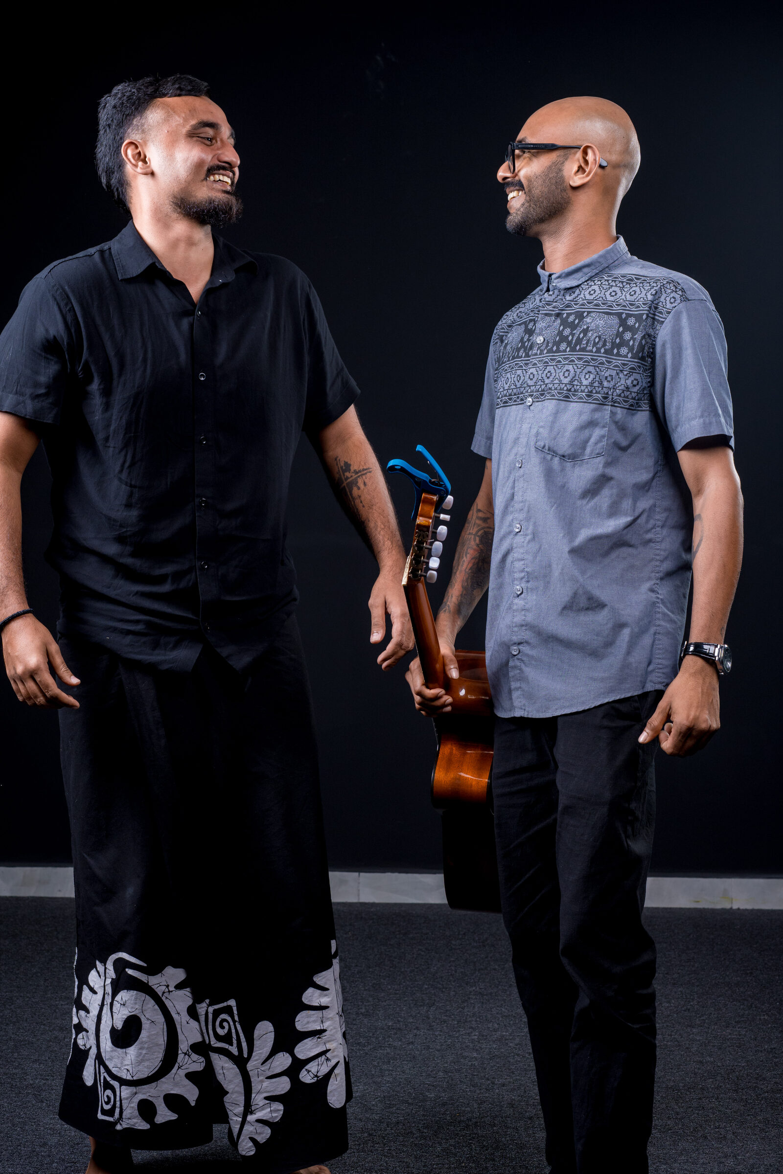Guitarist and singer facing each other