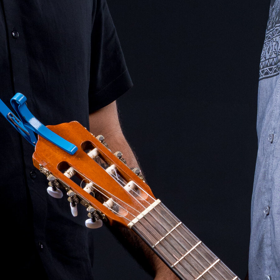 The guitar bridge and a blue capo